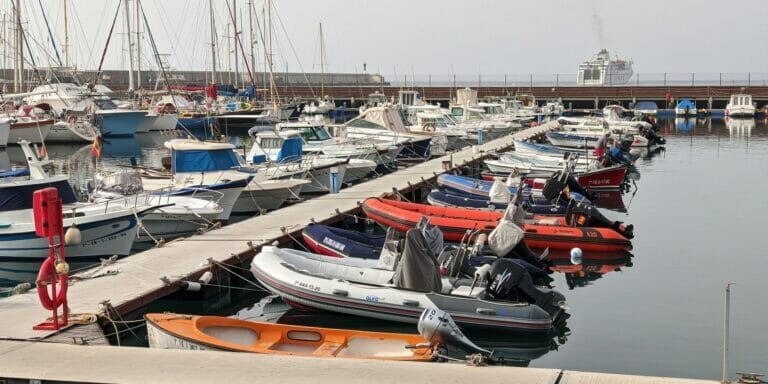 docks in a marina with special focus on a few inflatable boats