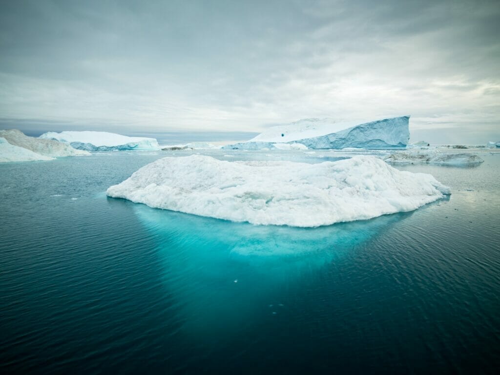 Iceberg in Greenland floating on the ocean surface
