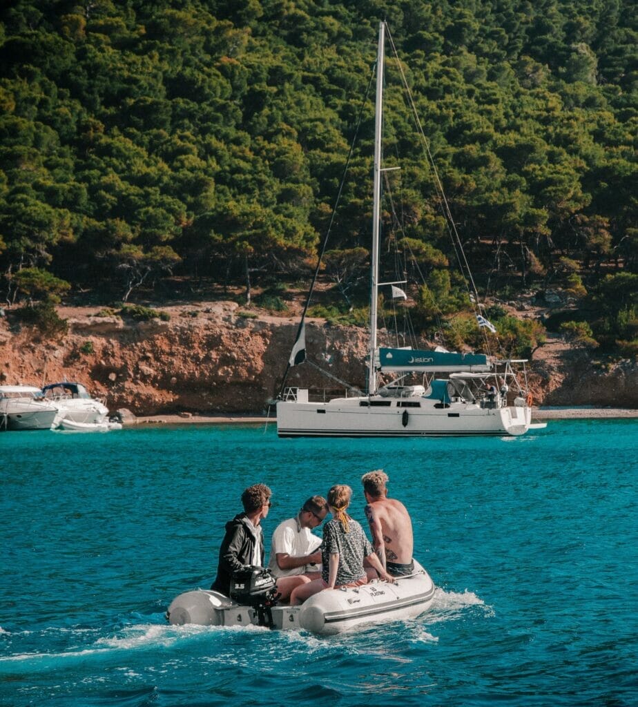 Boat crew driving in their dinghy back to their yacht